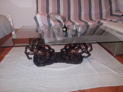 Glass table with "horses"
