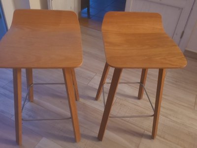 Two solid wood designer stools.